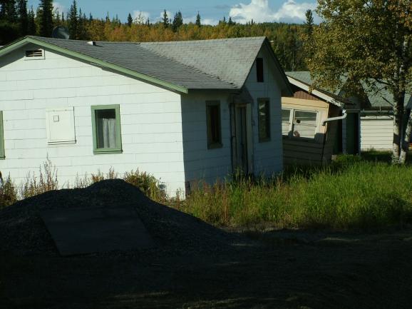 Damaged houses built over ice-rich permafrost on Madcap Lane in Fairbanks