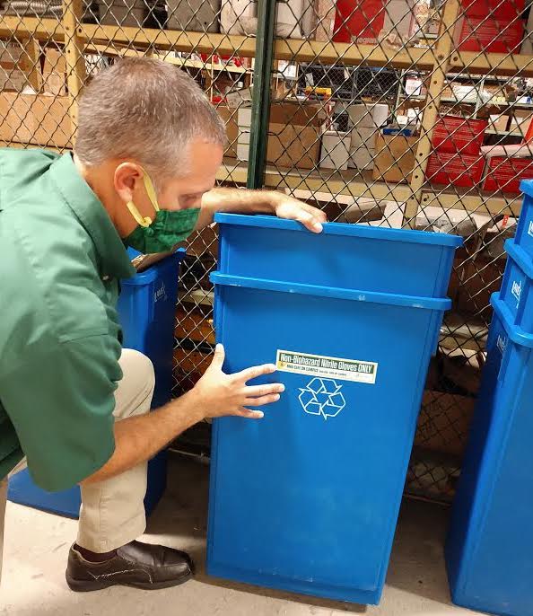 Lee Gould with a glove recycling bin