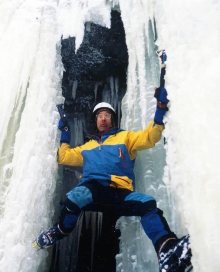 Watts playfully ice climbing (Bill Thompson photo)