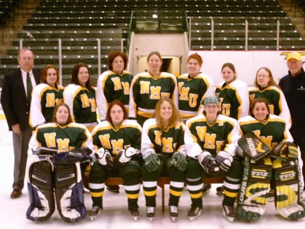 Valascho (second row, third player from right) with her NMU club teammates