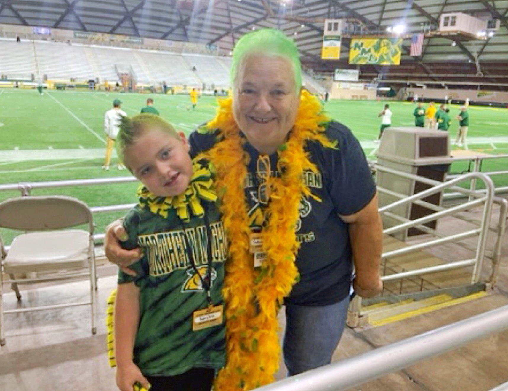 Past photo of Andel and grandson Karsten in green-haired solidarity