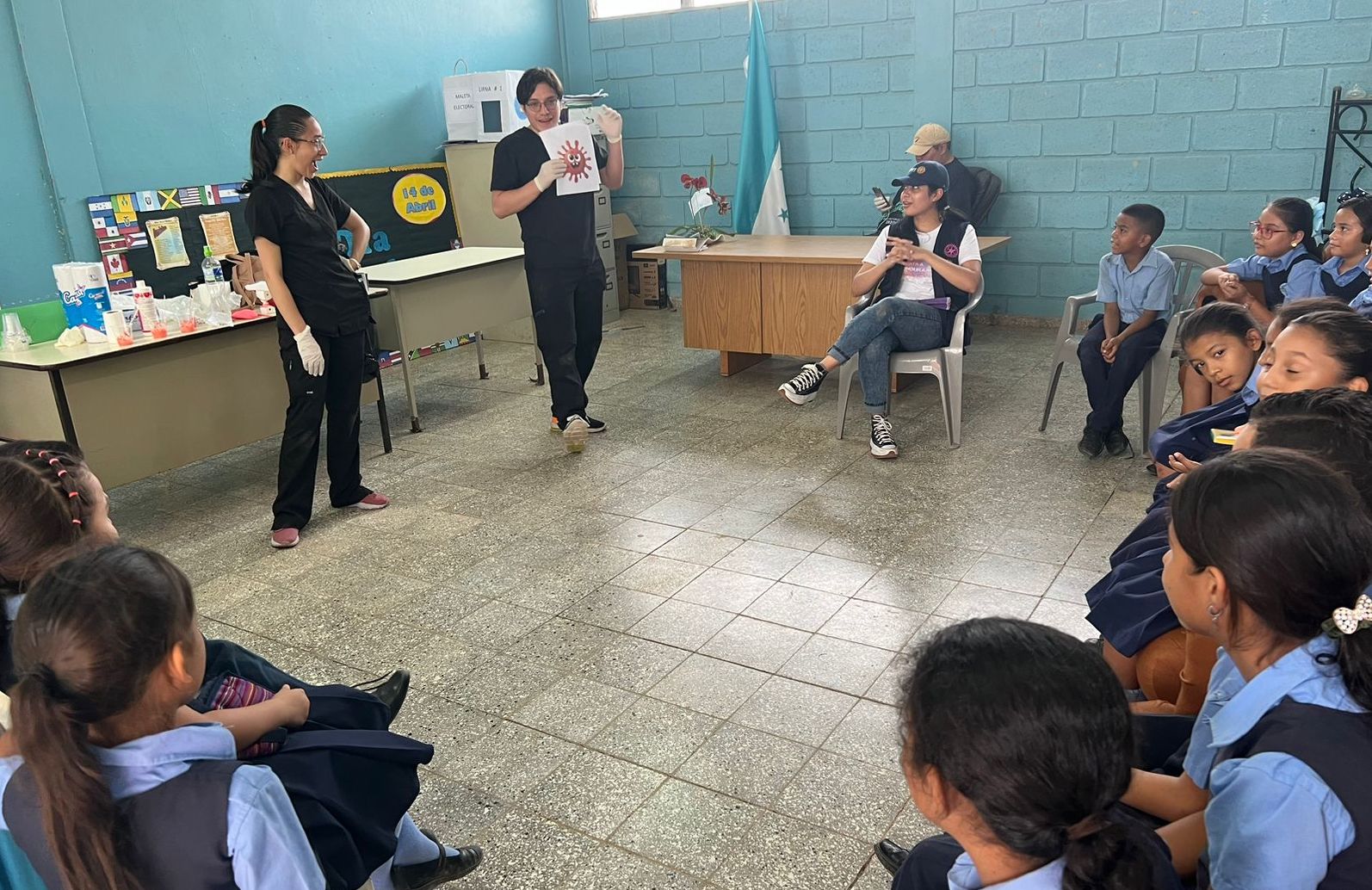 Sosa (standing left) helps with a presentation in Choluteca.