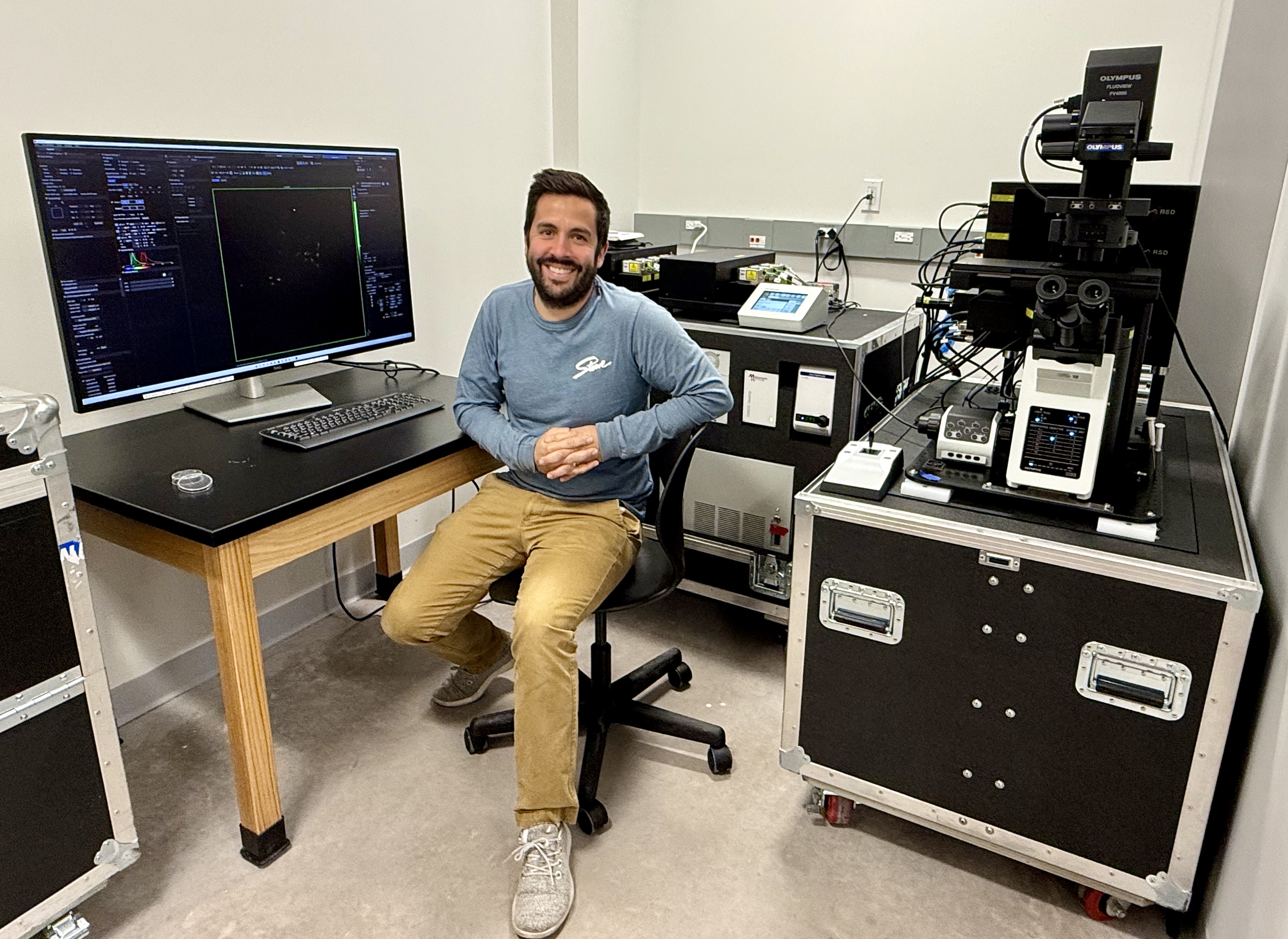 Assistant Professor Danny LeBert in the Microscopy Suite's room dedicated to a high-end Olympus demo microscope used in his research. He said NMU is seeking funding to secure a similar model on a permanent basis.