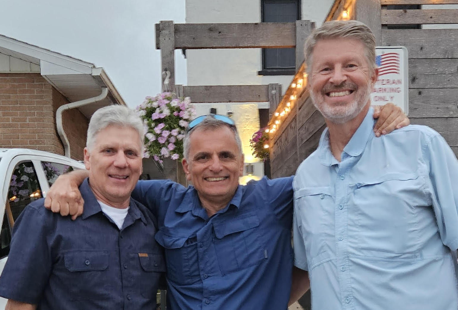Erhan Raif is pictured center at a separate get-together with Greg O'Dell, who wasn't able to attend the barbecue, and Scott DeKryger.