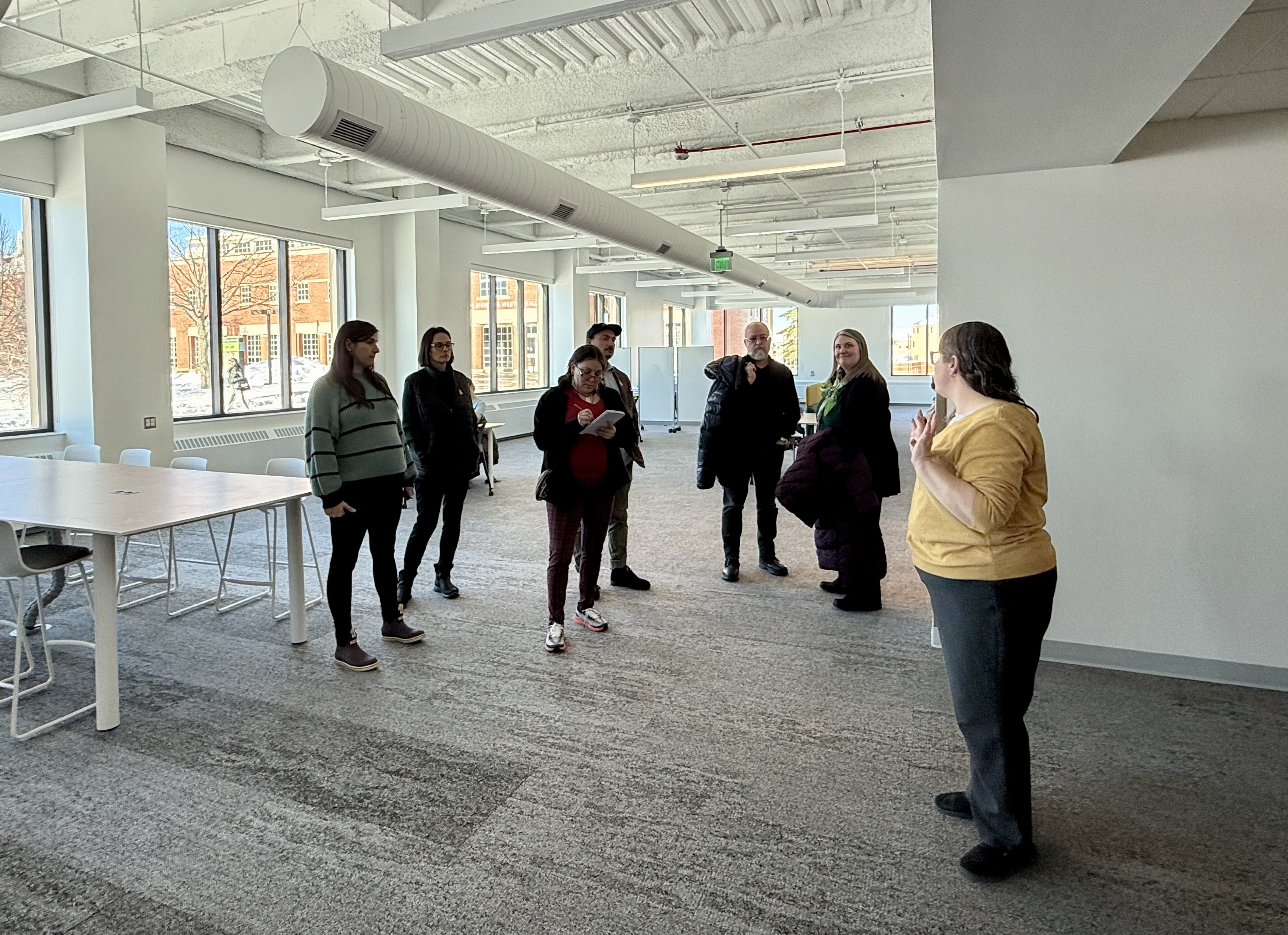 Bridger Wilson leads a tour group through the new Learning Commons
