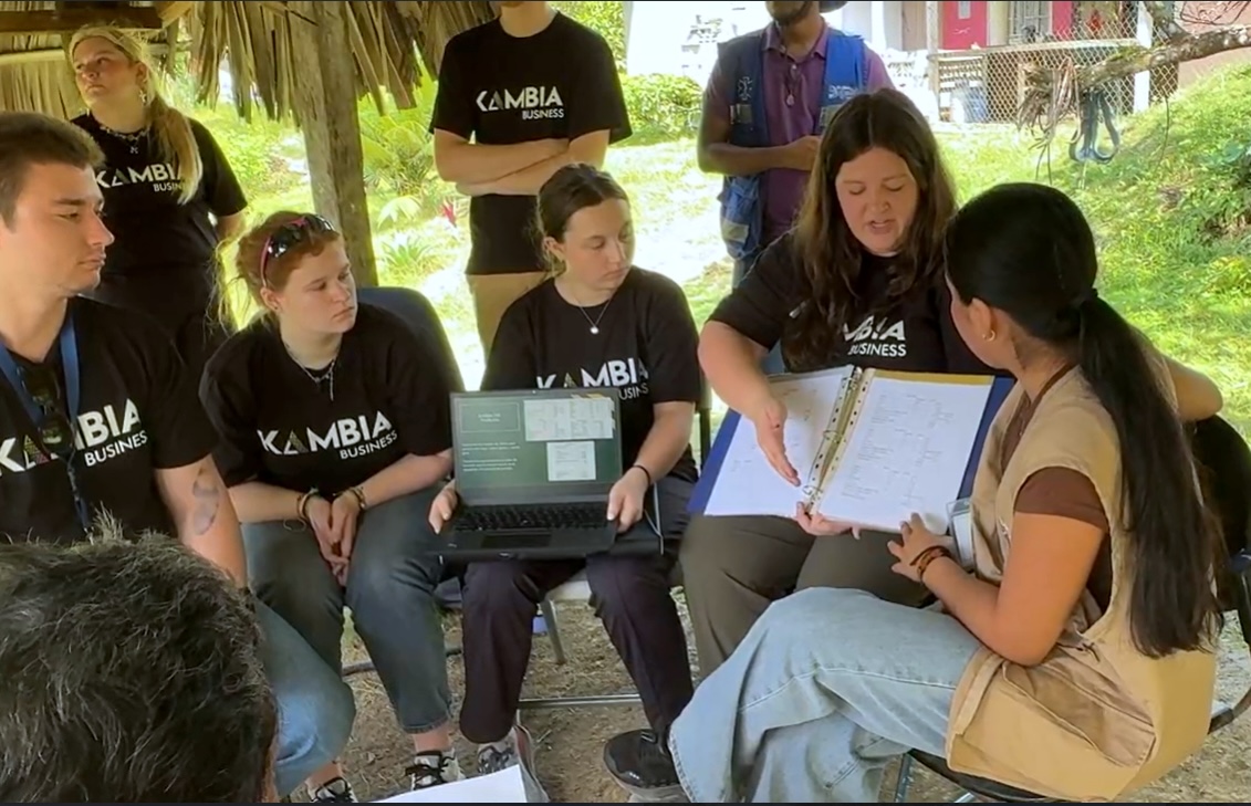NMU students (seated from left) Sergiy Blackwood, Anna Tousley, Katie Shogren and Brooke Kluz and an interpreter during a presentation to a client