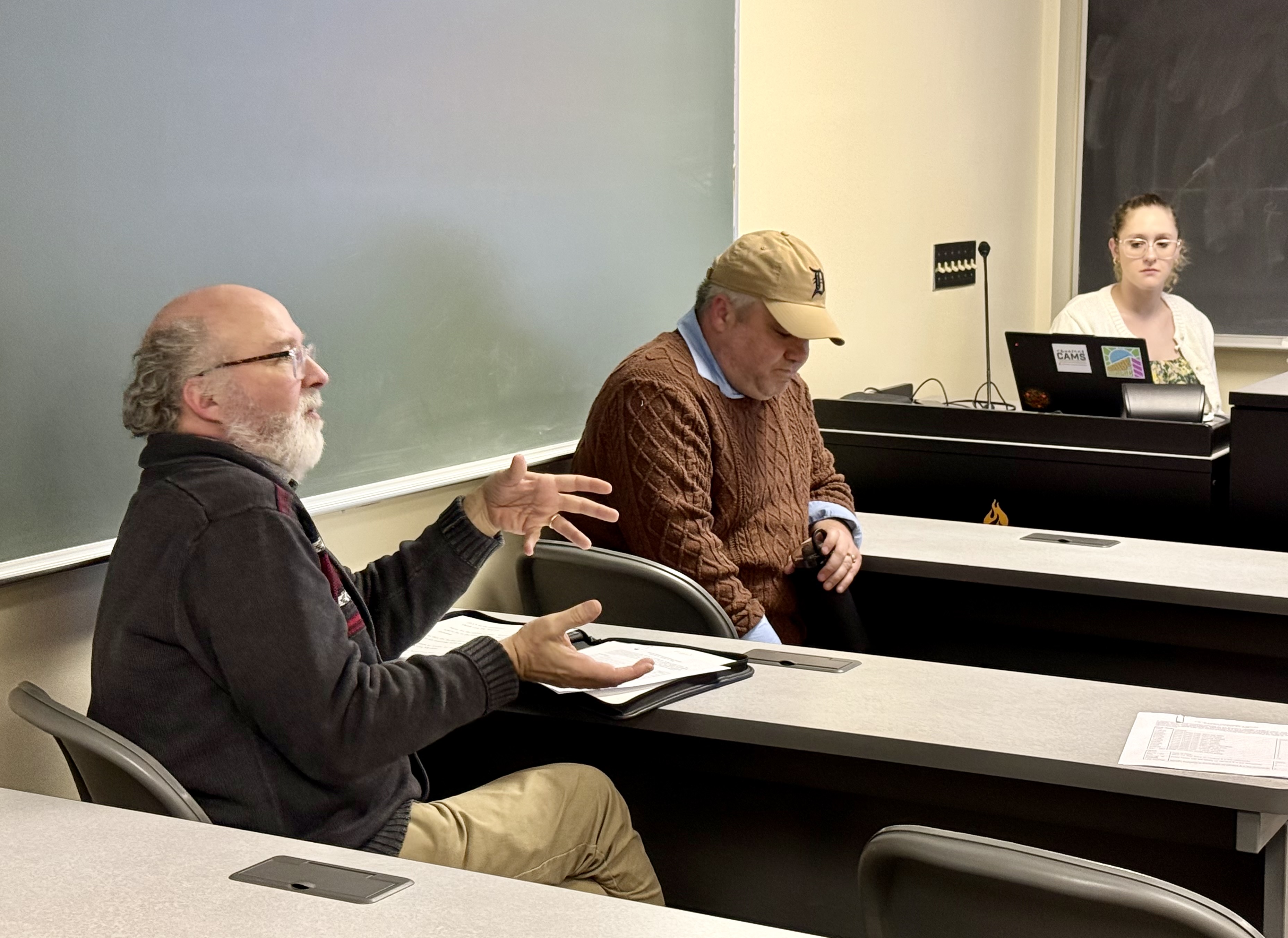 Beaumier U.P. Heritage Center Director Dan Truckey shares his gratitude for the students' work. Assistant Professor Josh Ewalt is pictured behind him.