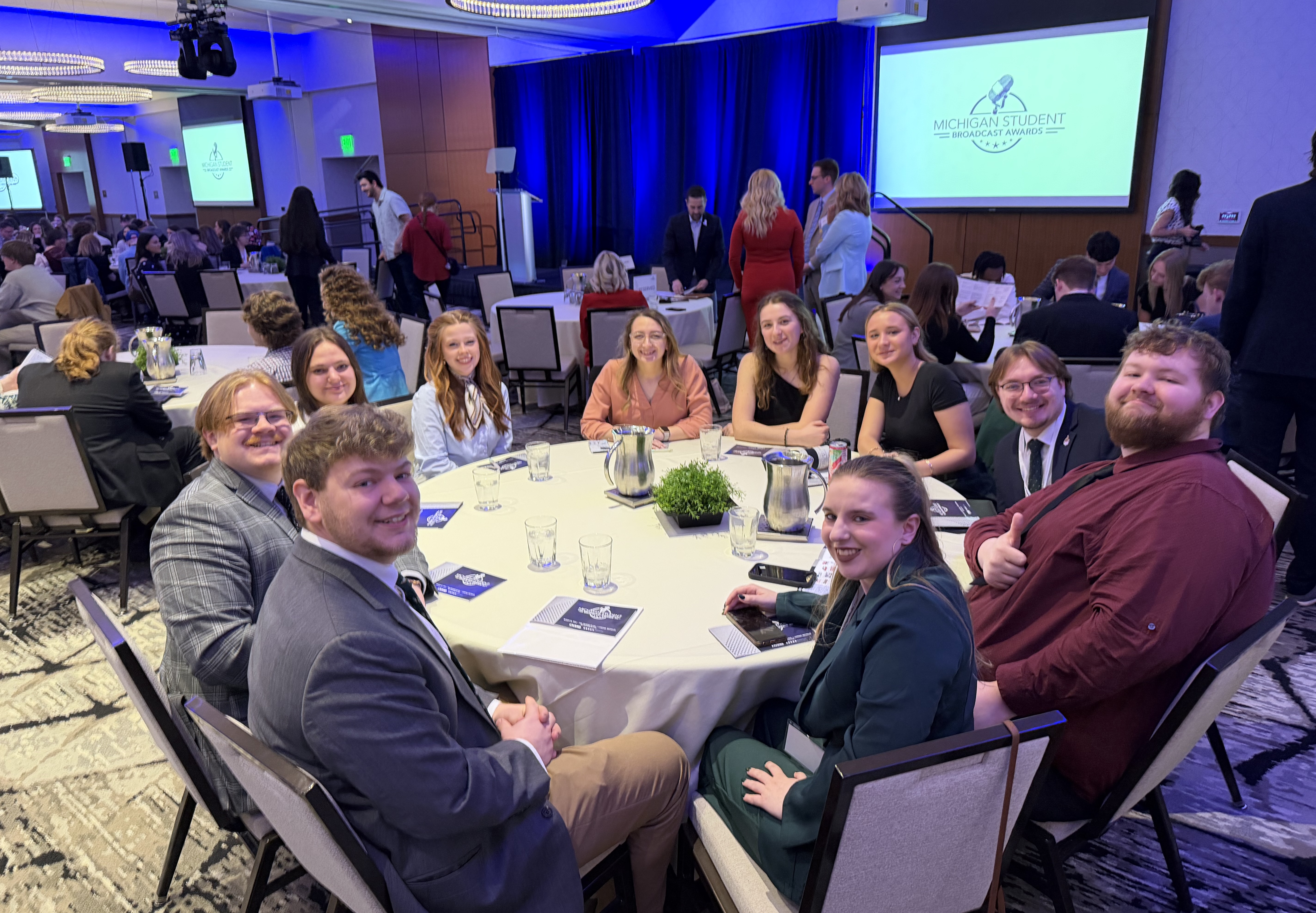 CAMS students at the 2026 Michigan Student Broadcast Awards (left to right around the table): Nathan Phipps, Austin Graham, Ava Larson, Maggie Franzen, Bianca Kroll, Norah Lee, Kali Sturdivant, Luke Knittel, Tristen Harsila and Emma Marotz (Photo by Mark Shevy)