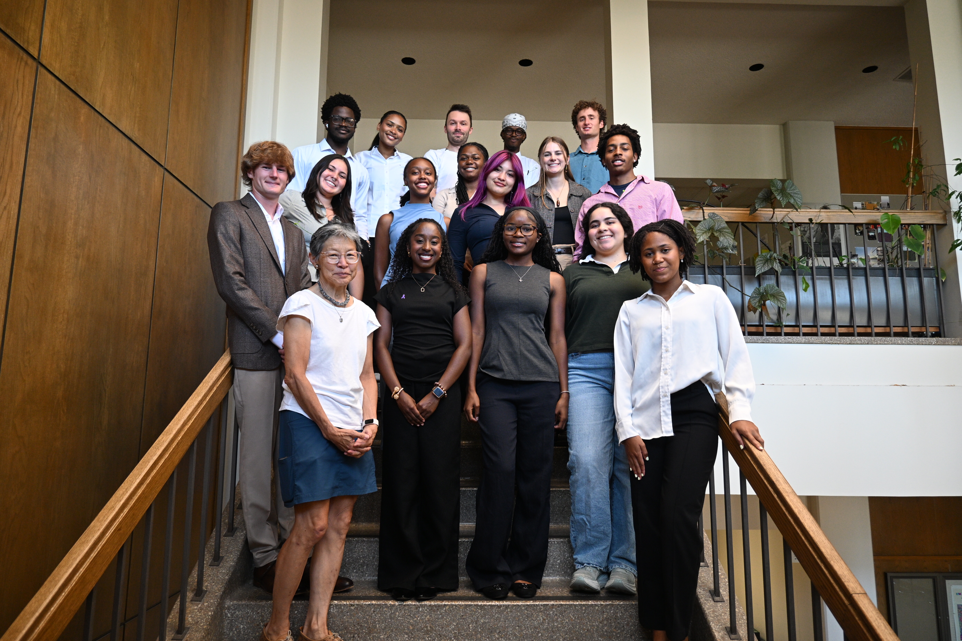 Anderson, standing in the back, poses for a photo with the entire research group.