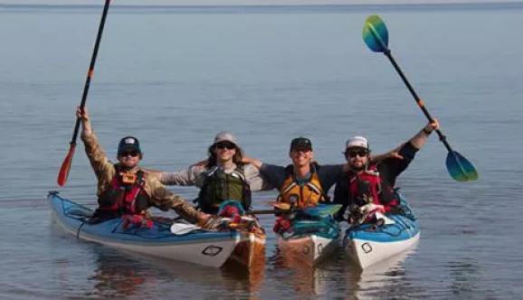 Four kayakers in their kayaks