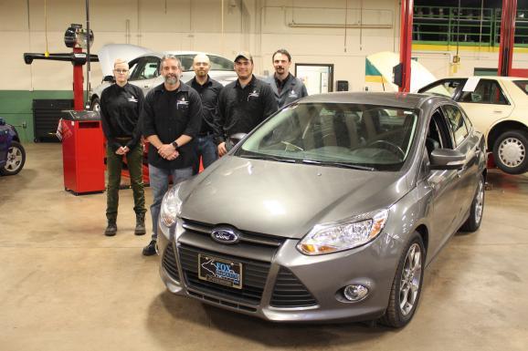NMU students and faculty with the Ford Focus