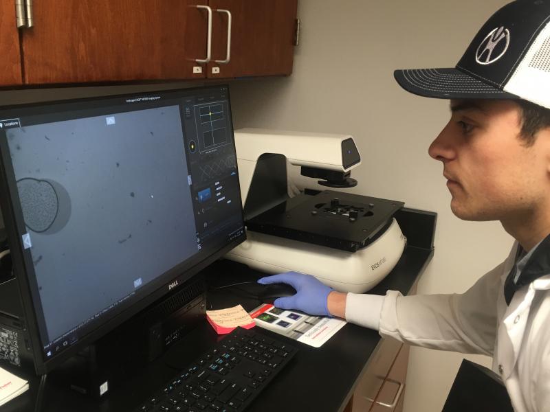 Graduate student Joe Duffy looks at an image generated by the new microscope.