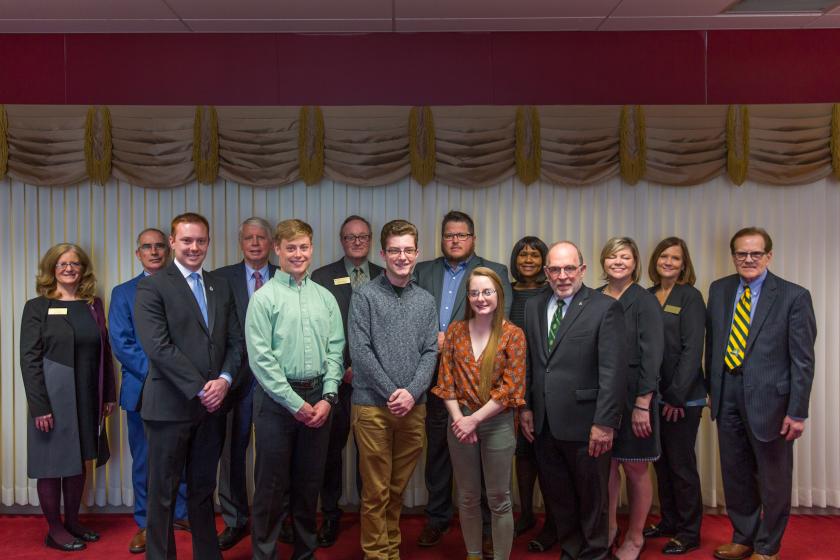 From left: Trustee Tami Seavoy, NMU Board Chair Robert Mahaney, Connor Loftus, Trustee James Haveman, Ryan Watling, Trustee Stephen Young, Michael Stamm, Kevin Store, Hailey Donohue, Trustee Bridget Summers, NMU President Fritz Erickson and Trustees Alexis Hart, Lisa Fittante and Steve Mitchell.