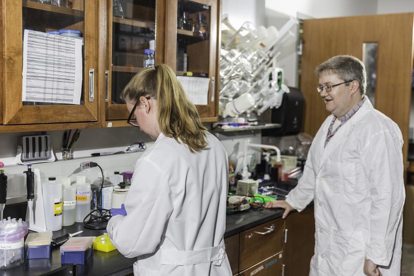 Sharp (right) in his lab with former NMU Lundin Honors Summer Research Fellow Maggie Bohm.