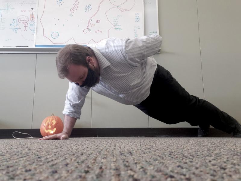 UAW Local 2178 member and challenge participant Ben Chaney does a pushup in his office.