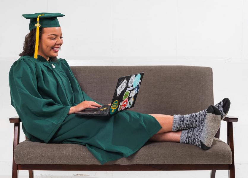Graduate with computer (NMU stock photo)