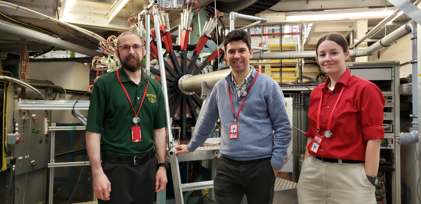 From left: Mengyan, Rui Vilao (University of Coimbra, Portugal) and Goeks in front of an instrument while working on an experiment at Rutherford Appleton Laboratory