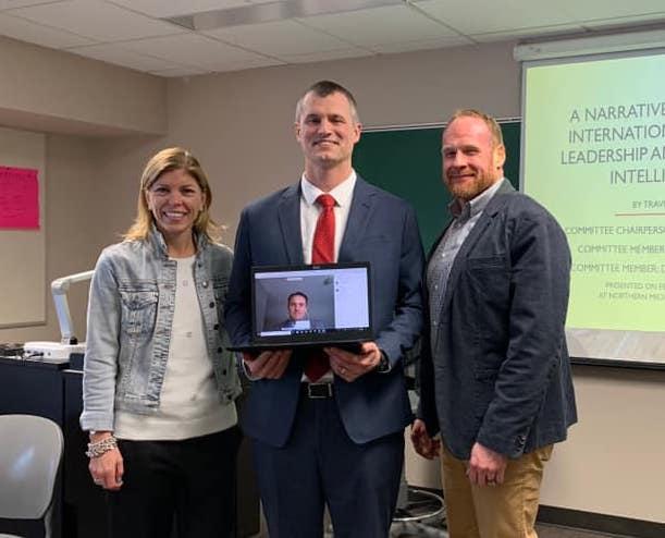 Smith (center) after successfully completing the NMU EdS pathway into the Central Michigan University EdD program in February 2020