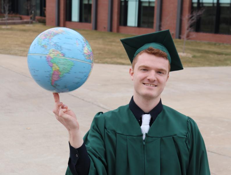 The world is spinning with possibilities for NMU 2021 grads, like Jared Evans of Marquette, to make a difference.