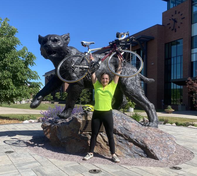 Stypulkowska in front of the Wildcat statue on campus