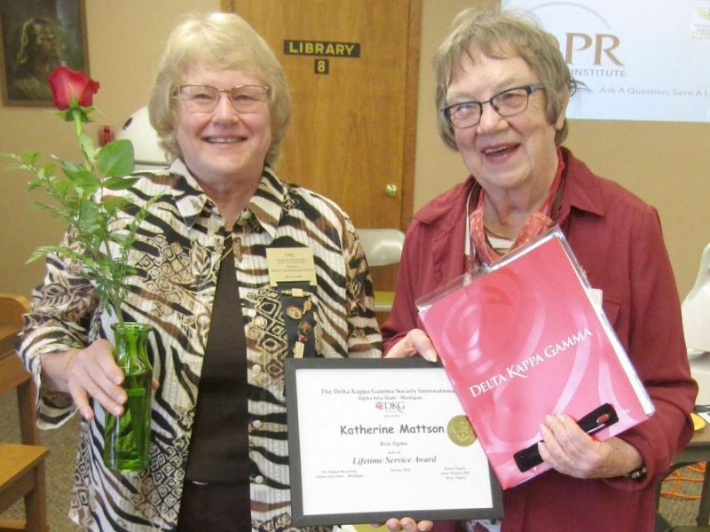 Debra Pajula, left, co-president of Beta Sigma Chapter, with Kay Mattson, the DKG Michigan State Organization’s Lifetime Service Award recipient (Iron Mountain Daily News photo)