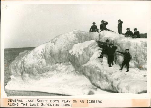 Boys playing near Lake Superior ice