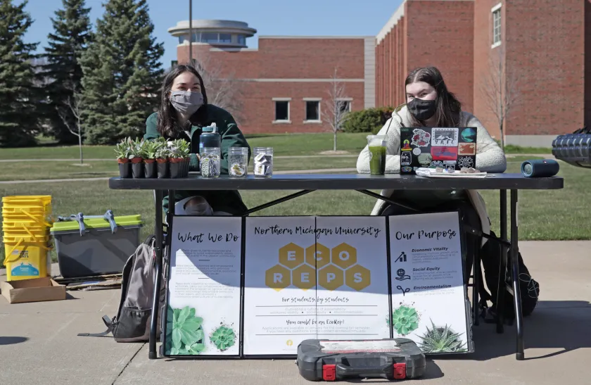 Giesey (right) with Heather Vivian at their Earth Week table in 2021