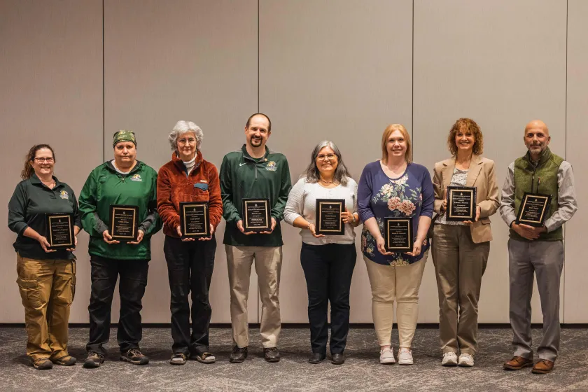Excellence in Service Award winners (from left) Hegmegee, Ross, Sproull, Laxo, Mankee, Demboski, Thurston and Hamel