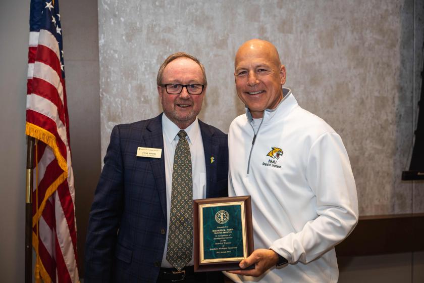 Popp (right) with NMU Board Chair Steve Young
