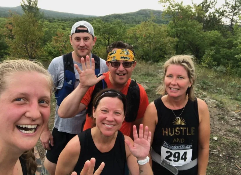 White (front center) with SLEPS colleagues and her husband completing the Four Peaks trail run last summer.