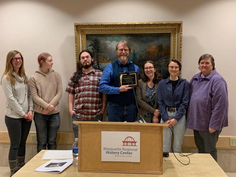 Central U.P. and NMU Archives representatives at the award ceremony (from left): Samantha Pynnonen, student employees Aura Wahl-Piotrowski and Elijah Croschere, Marcus Robyns, Annika Peterson, student employee Kaitlyn Spiegl and volunteer Karen Kasper