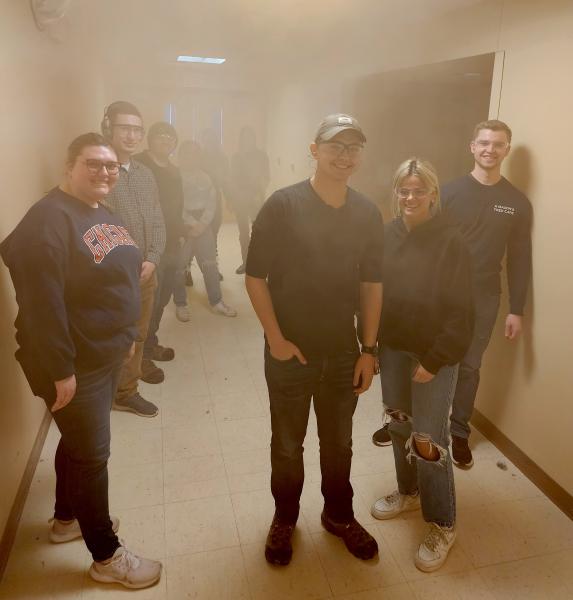 Students in a smoke-filled hallway prepare for role-playing duty (Chris MacMaster photo)