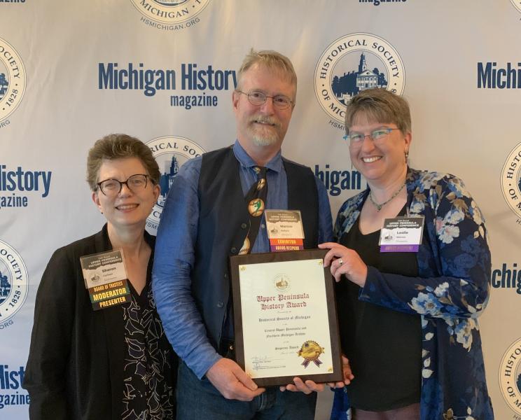From Left: Sharon Carlson, award presenter; Marcus Robyns, university archivist and UPLINK project director; and Leslie Warren, NMU interim associate provost and dean of Library and Instructional Support