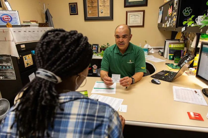 Adviser Jose Garcia with a student