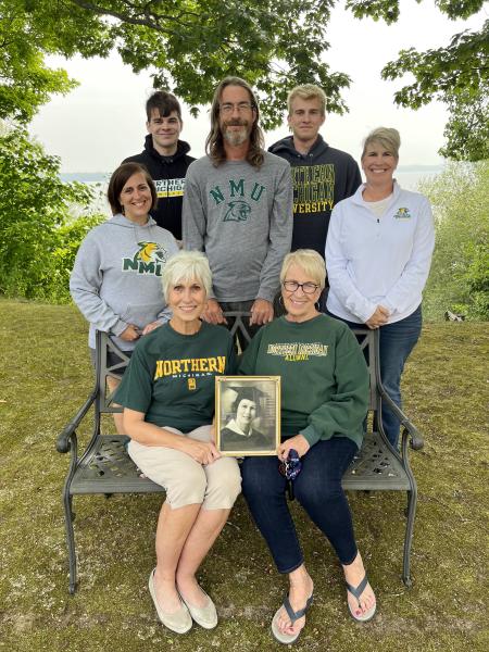 Pictured in the photo seated are Karen Baker Valot ‘75 and Joan Baker Kelley ‘72, holding a photo of mother Alice Westman Baker ‘38, taken on her graduation day. Standing are her grandchildren Alicia Valot Powers ‘08, Shawn Kelley ‘00, and Rebecca Kelley Valot ‘98. Incoming NMU students Jaren Valot and Noah Valot are continuing the family tradition.