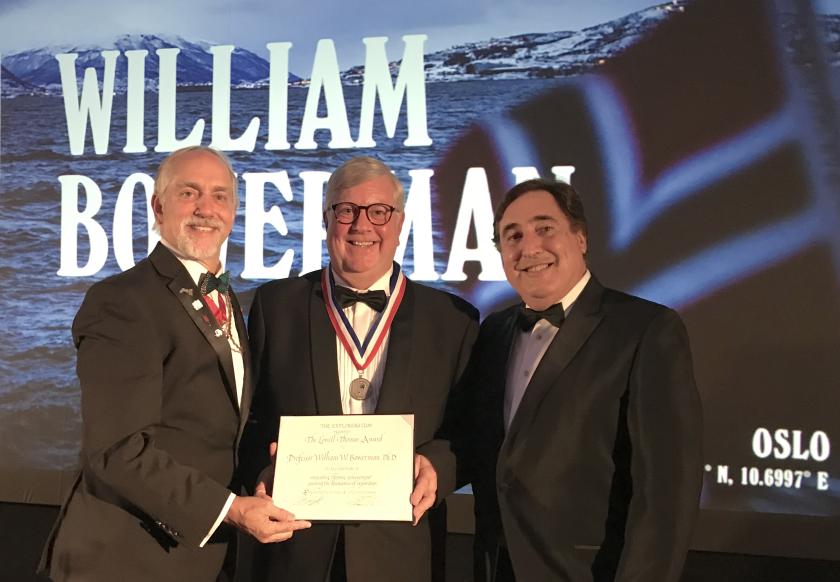Bowerman (center) being presented with the medal and certificate for the Lowell Thomas Award by The Explorers Club President Richard Garriott (left) and Vice President for Flags and Honors Martin Nweeia (right).
