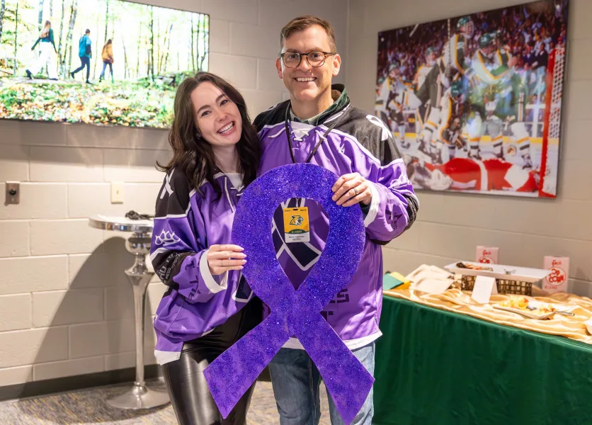 Preston with NMU President Brock Tessman at the Wildcat hockey game vs. LSSU