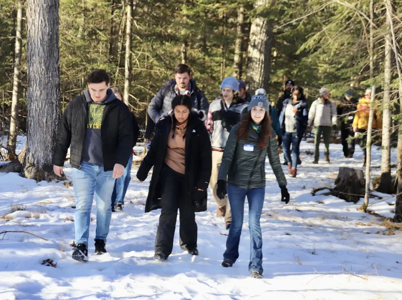 NMU students and Detroit Outdoors participants on a hike at Presque Isle Park