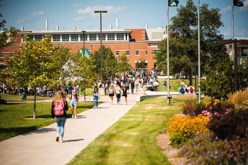 Students walking on campus (NMU stock photo)