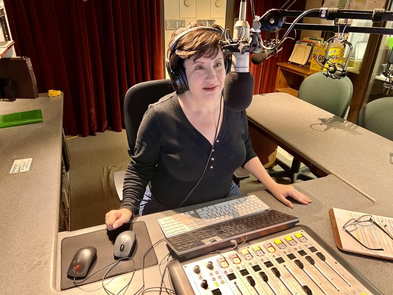 Nicole Walton behind the microphone in the Public Radio 90 studio.