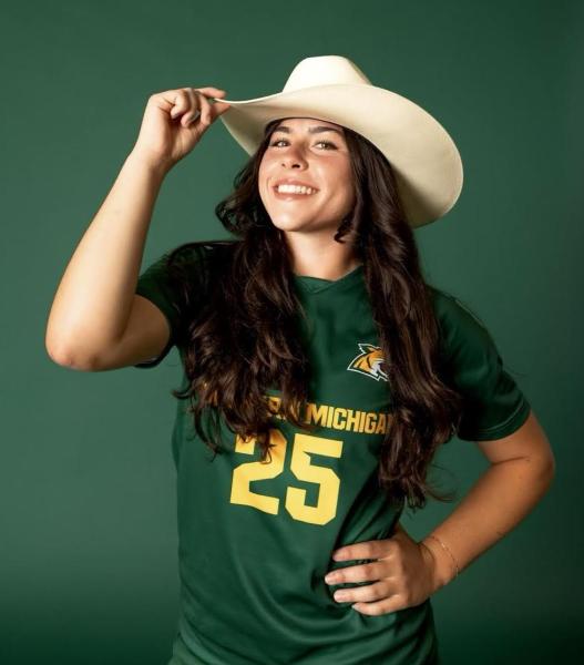 Sami Brown wearing her hat and soccer jersey