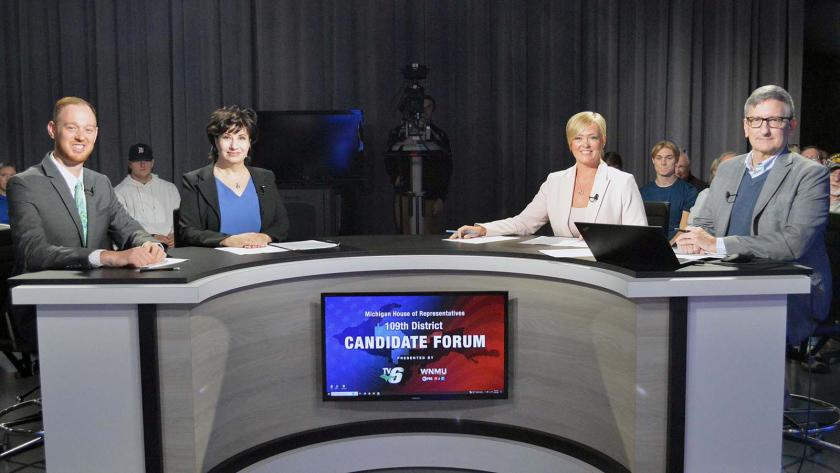 The media representatives and moderator participating in the debate (LaCombe, Walton, Peterson and Settles)