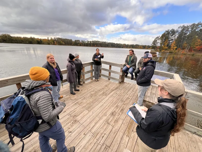 Students lead a "practice tour" along the Dead River