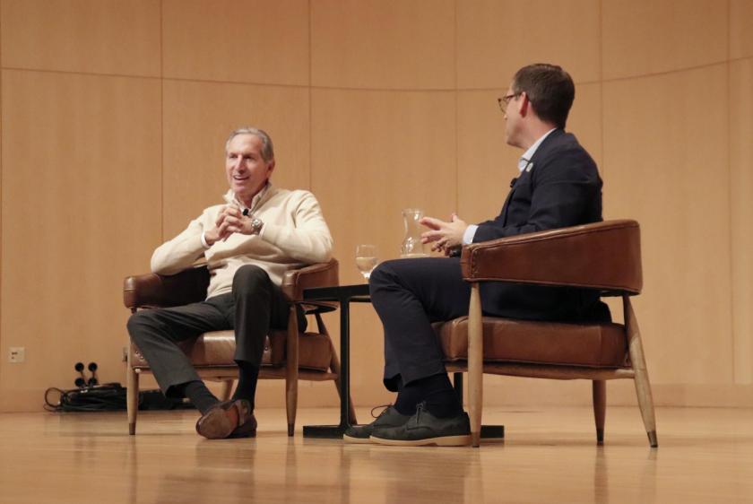 Howard Schultz (left) addresses students during a conversation moderated by President Brock Tessman