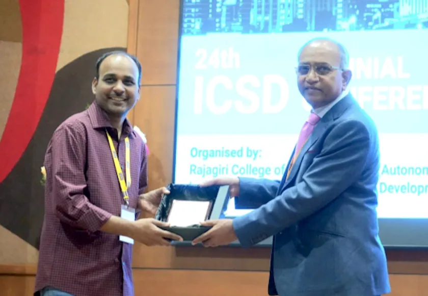 Kumar being recognized for his work with ICSD at the conference.