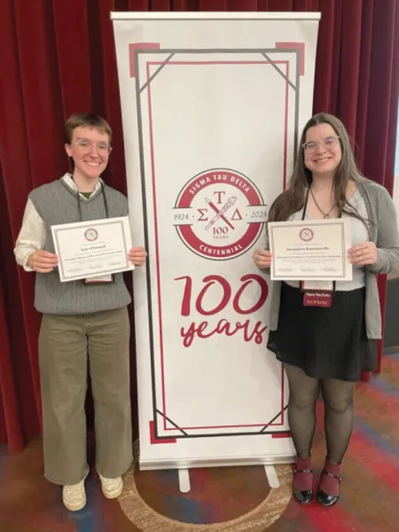 Erin O'Donnell (left) and Alexandria Bournonville are pictured with their awards at the Sigma Tau Delta national conference in Pittsburgh