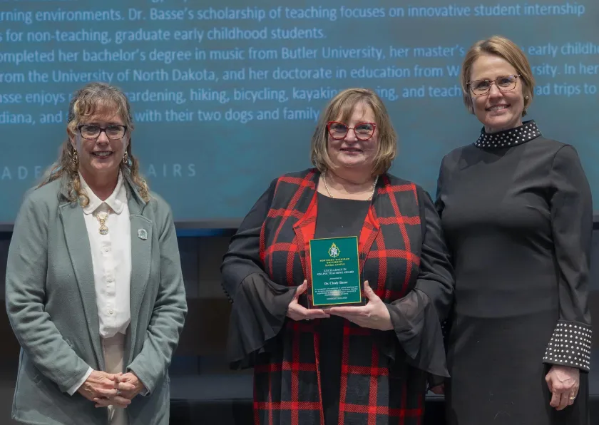 Assistant Professor Cindy Basse (center) with Liz Wuorinen, dean of the College of Health Sciences and Professional Studies (left) and Provost Anne Dahlmanand Provost Anne Dahlman