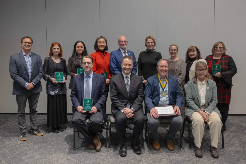 Attending award winners and administrators at the recognition event included (front from left): Michael Crum, Adam Naito, Paul Truckey and Liz Wuorinen. (Back from left): Steve VandenAvond, the mother of recipient Shaun Shepard (accepting on her behalf), Lin Fang, Zhuang-Zhong “Z.Z.” Lehmberg, Rob Winn, Anne Dahlman, Diana Lafferty, Carol Johnson and Cindy Basse.