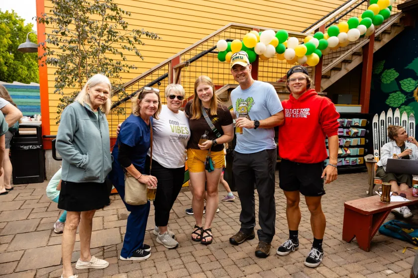 Photo of attendees at a summer 2024 Alumni Happy Hour