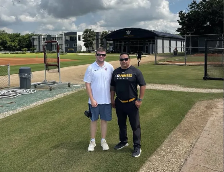 Athletic training master's student Dillon Makela (left) and alumnus Alex Mena at a baseball complex in the Dominican Republic.